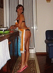 Hot looking milf brunette wife sucking and fucking husband at home after making a dinner in the kitchen - homemade porn photos