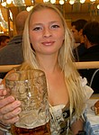Beautiful blonde girl from Germany is a real waitress at the October fest party. She was picked up by some foreigner and seduced to have amateur sex at his place. See her beautiful nude photos posing on bed
