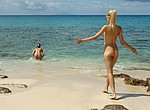Nudist girls sunbathing on the beach and flashing pussies to strangers to tease them for a short romance and good fuck in the evening