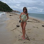 beautiful nudist girl sunbathing naked on island vacation 